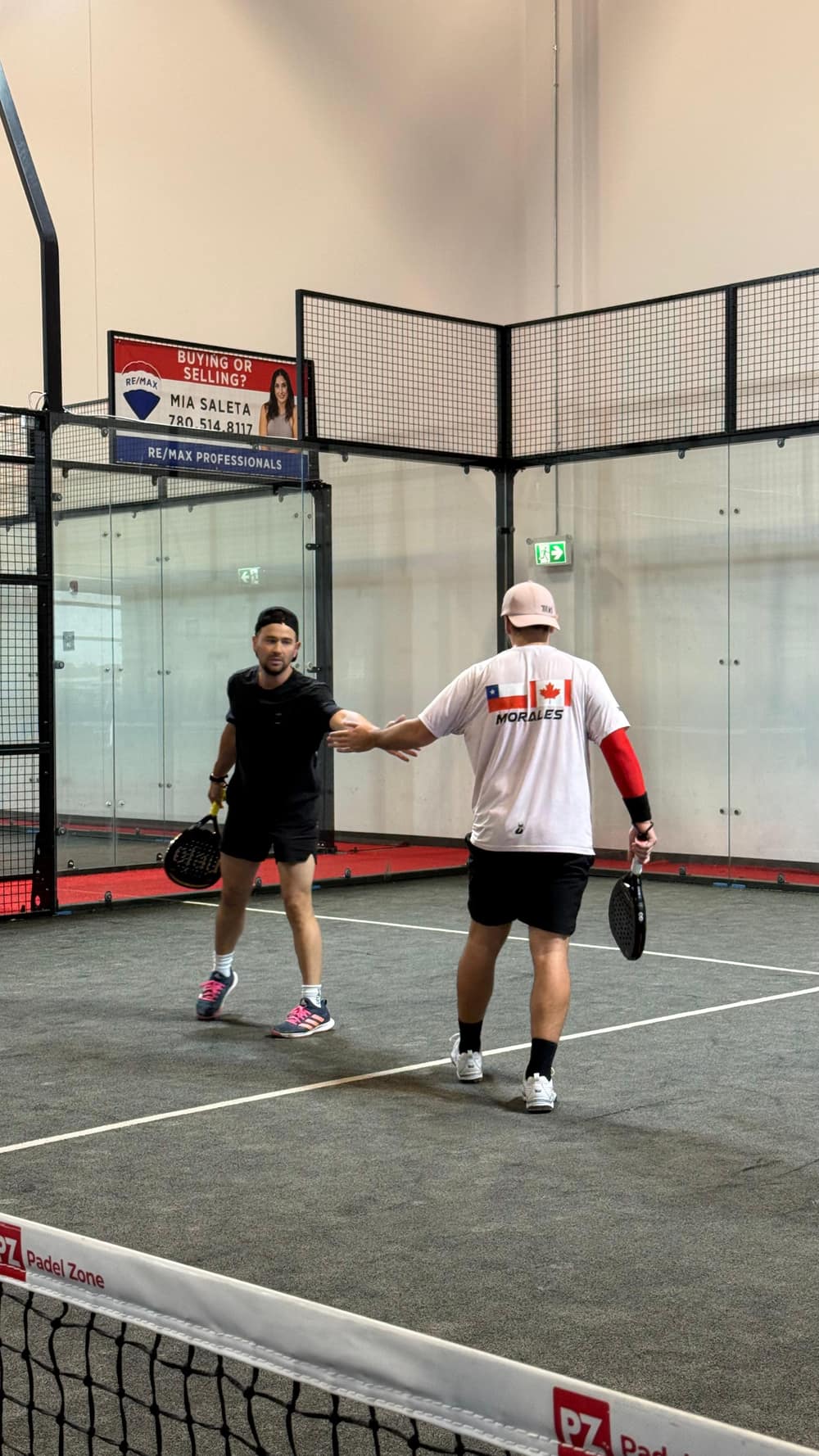 Two players shaking hands after a point